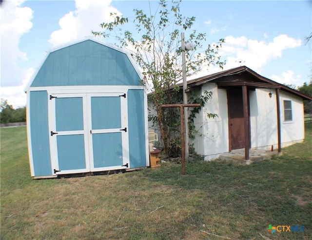 view of outbuilding with a lawn