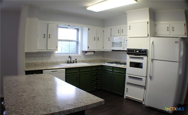 kitchen with white cabinetry, green cabinets, decorative backsplash, white appliances, and sink