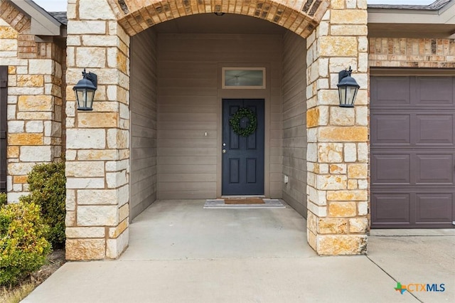 entrance to property with stone siding