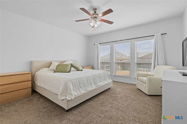 bedroom featuring carpet flooring, a ceiling fan, and baseboards