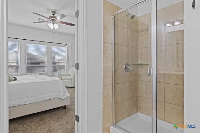 ensuite bathroom featuring a stall shower, connected bathroom, and ceiling fan