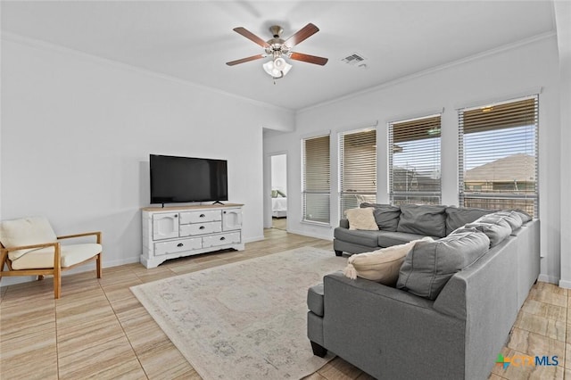 living room with ceiling fan, baseboards, visible vents, and ornamental molding