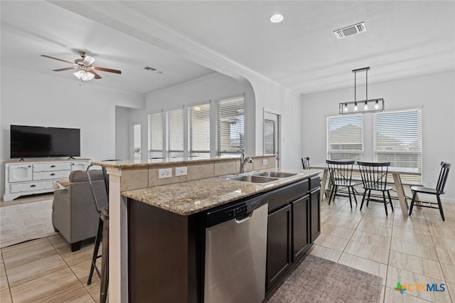 kitchen with visible vents, a ceiling fan, a sink, open floor plan, and dishwasher