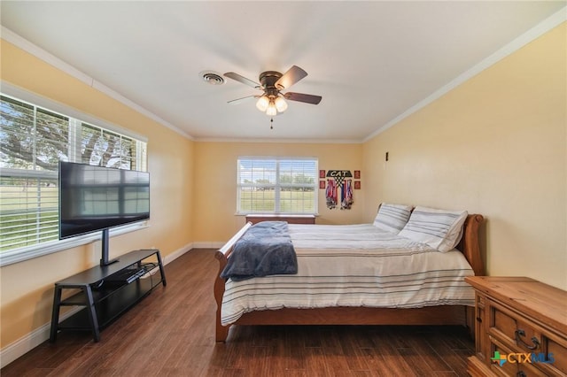 bedroom featuring baseboards, ornamental molding, dark wood finished floors, and a ceiling fan