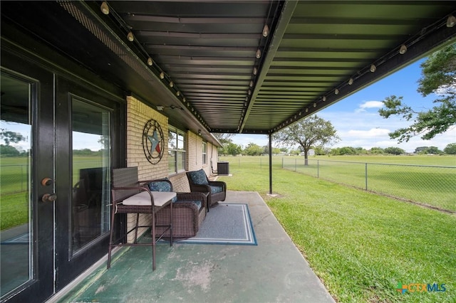 view of patio / terrace featuring fence