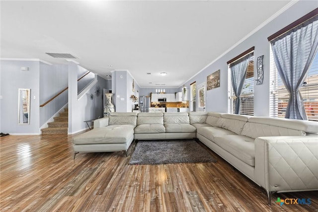413 E Orion Dr, Killeen, TX 76542 - living area with stairway, ornamental molding, wood finished floors, and baseboards