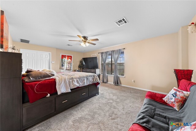 bedroom with light carpet and ceiling fan