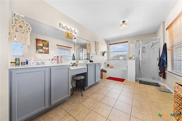 413 E Orion Dr, Killeen, TX 76542 - full bath featuring double vanity, a bath, a shower stall, and tile patterned flooring