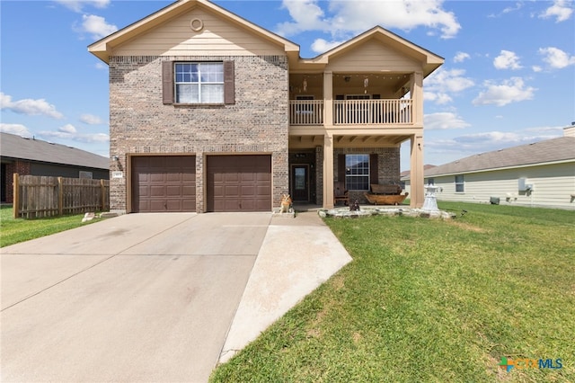 view of front of property with a garage, a front yard, and a balcony