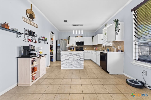 kitchen with light tile patterned floors, black appliances, white cabinets, and crown molding