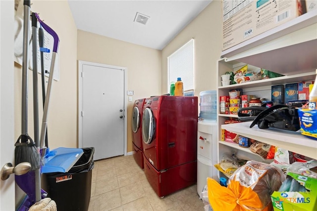 413 E Orion Dr, Killeen, TX 76542 - laundry area with washer and clothes dryer and light tile patterned floors
