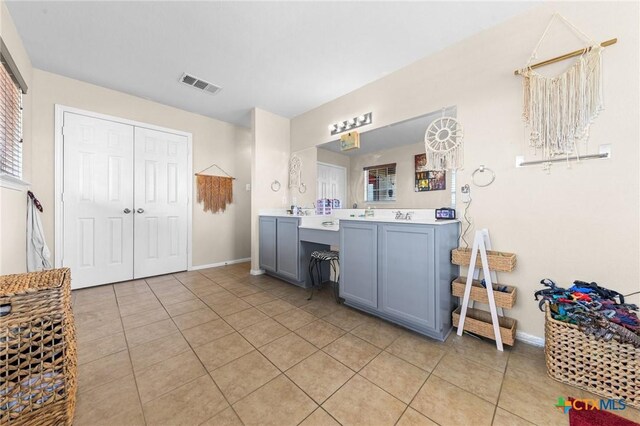 413 E Orion Dr, Killeen, TX 76542 - bathroom with vanity, tile patterned floors, and baseboards