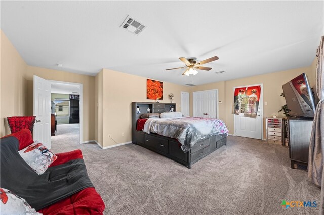 carpeted bedroom with ceiling fan