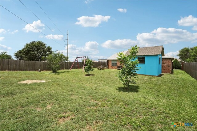 2606 Wesley Dr, Killeen, TX 76549 - fenced backyard with a playground