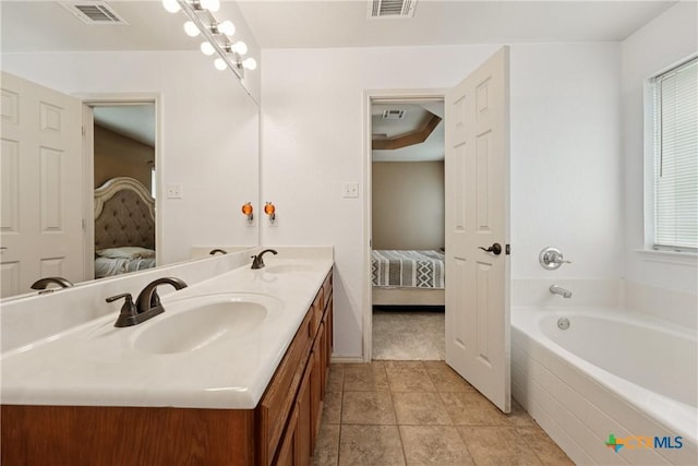 2606 Wesley Dr, Killeen, TX 76549 - full bathroom with connected bathroom, double vanity, a garden tub, and tile patterned flooring