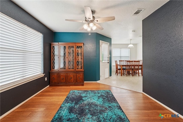 2606 Wesley Dr, Killeen, TX 76549 - foyer entrance with a ceiling fan, wood finished floors, and a textured wall