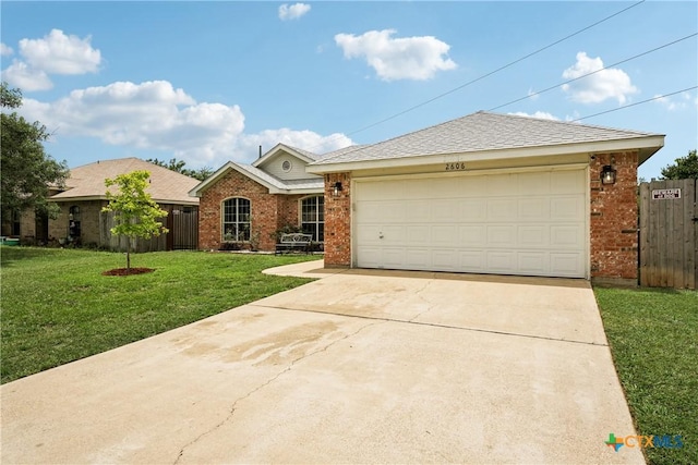 2606 Wesley Dr, Killeen, TX 76549 - ranch-style house featuring brick siding, concrete driveway, and an attached garage