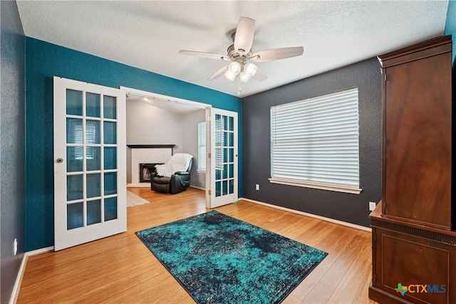 2606 Wesley Dr, Killeen, TX 76549 - interior space featuring wood finished floors, ceiling fan, a textured ceiling, and french doors