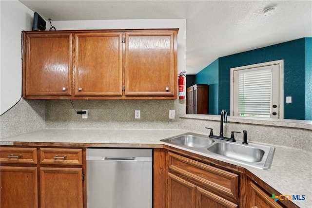 2606 Wesley Dr, Killeen, TX 76549 - kitchen with dishwasher, light countertops, brown cabinets, and decorative backsplash