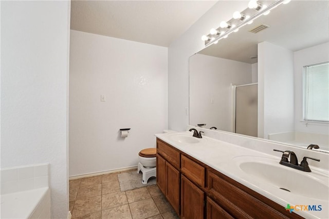 2606 Wesley Dr, Killeen, TX 76549 - full bathroom featuring double vanity, a stall shower, and a garden tub