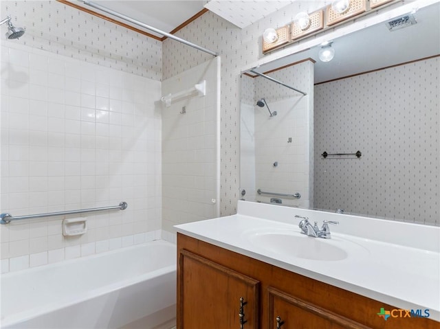 full bath featuring bathtub / shower combination, vanity, and wallpapered walls