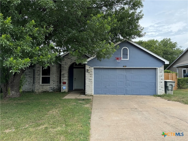 view of front of house with a garage and a front yard