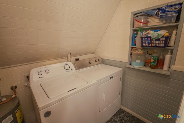 clothes washing area with independent washer and dryer