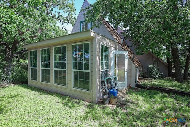 view of outdoor structure with a lawn