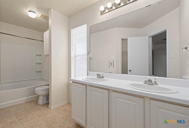 full bathroom with vanity, shower / bathing tub combination, and toilet