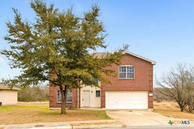 view of front of property with a garage and a front yard