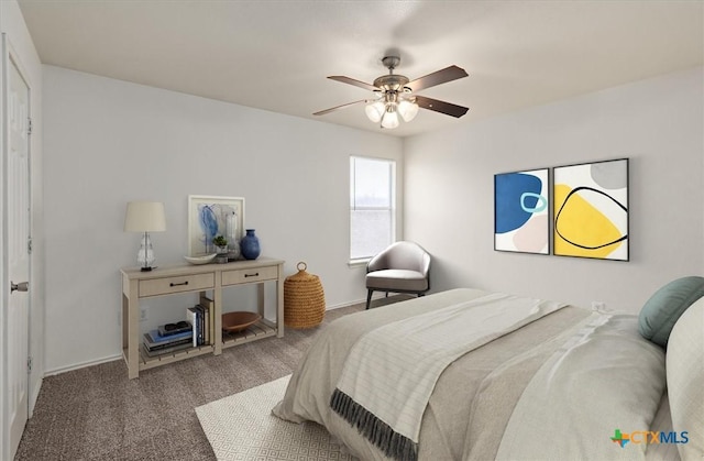 bedroom featuring ceiling fan and carpet