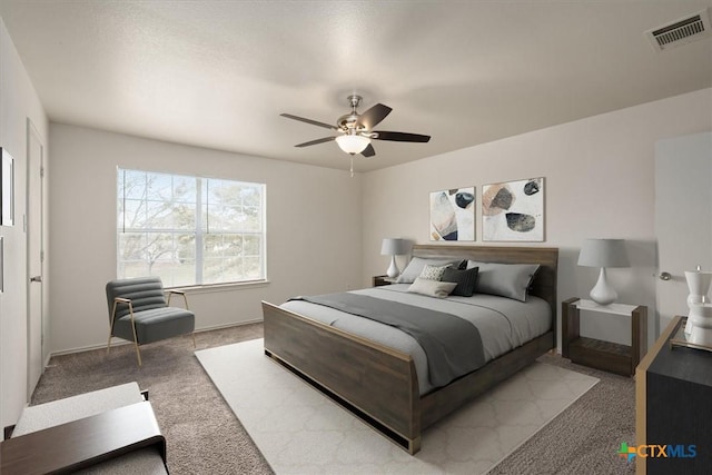 carpeted bedroom with ceiling fan