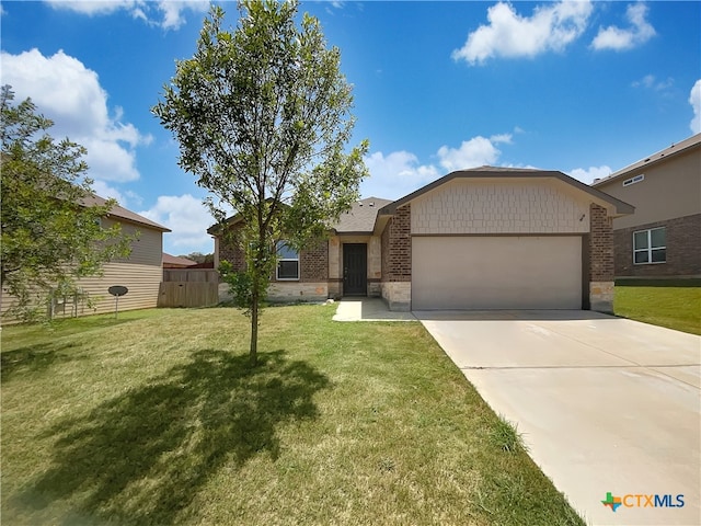 single story home featuring a front lawn and a garage