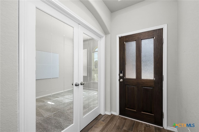 entryway with french doors, baseboards, and dark wood-style flooring