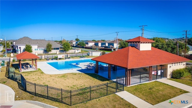 view of swimming pool with a gazebo, a patio area, a lawn, and fence