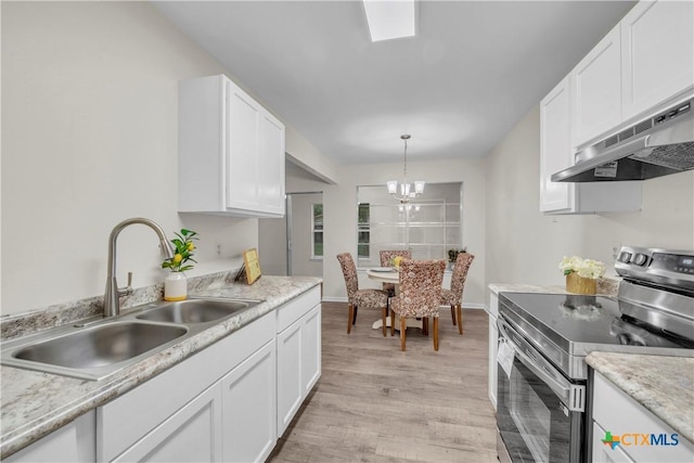 kitchen featuring a sink, stainless steel electric range, under cabinet range hood, and white cabinets