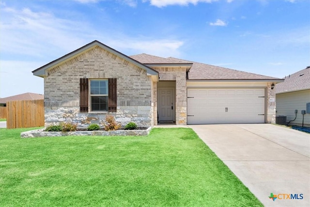 8812 Cantera Ridge Rd, Temple, TX 76502 - view of front of house with an attached garage, driveway, brick siding, central air condition unit, and a shingled roof