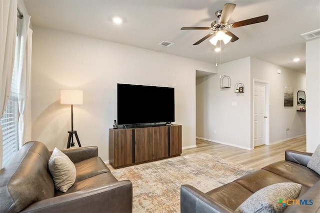 8812 Cantera Ridge Rd, Temple, TX 76502 - living room with ceiling fan, light wood finished floors, and baseboards