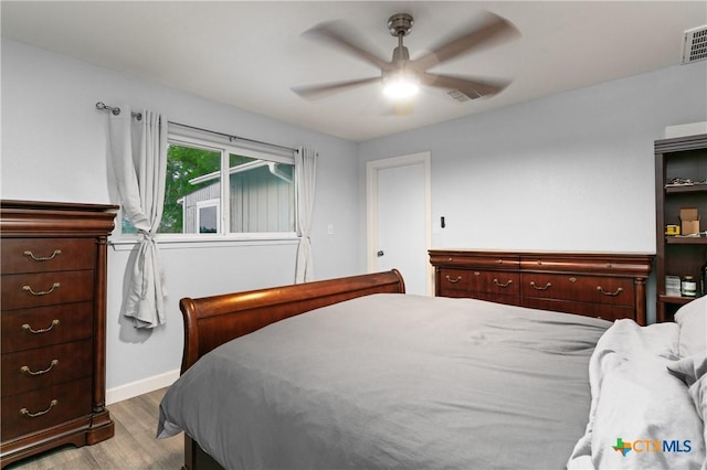 1236 County Road 7611, Devine, TX 78016 - bedroom featuring wood finished floors and a ceiling fan