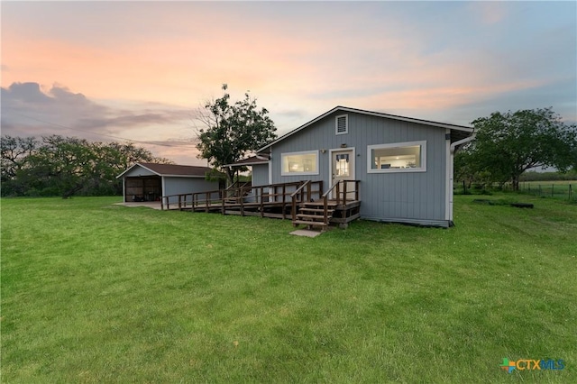 1236 County Road 7611, Devine, TX 78016 - back of house with an outbuilding, a yard, and a deck
