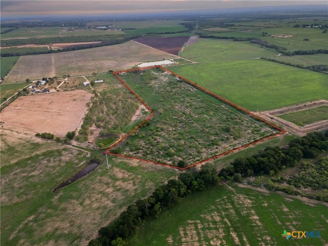 1236 County Road 7611, Devine, TX 78016 - aerial view of sparsely populated area featuring property boundaries highlighted and large plots for crops