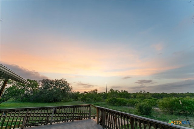 1236 County Road 7611, Devine, TX 78016 - view of deck at dusk