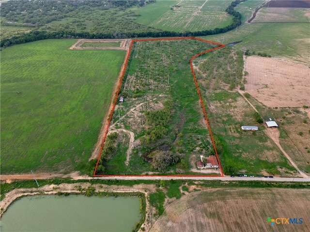 1236 County Road 7611, Devine, TX 78016 - overview of rural landscape with property boundaries highlighted and farmland