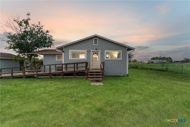 1236 County Road 7611, Devine, TX 78016 - back of property at dusk with entry steps