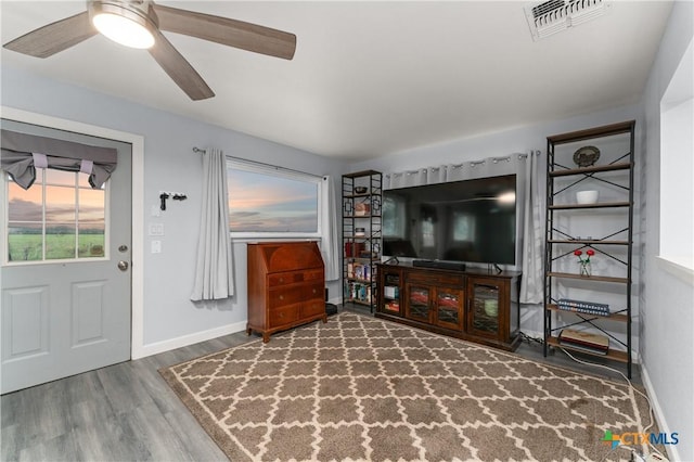 1236 County Road 7611, Devine, TX 78016 - living room featuring wood finished floors and a ceiling fan