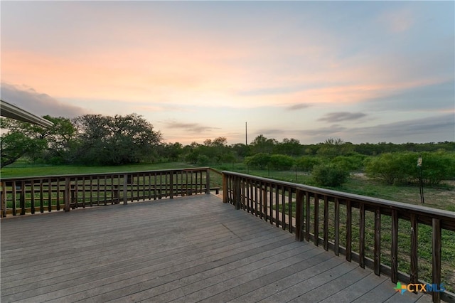 1236 County Road 7611, Devine, TX 78016 - view of deck at dusk