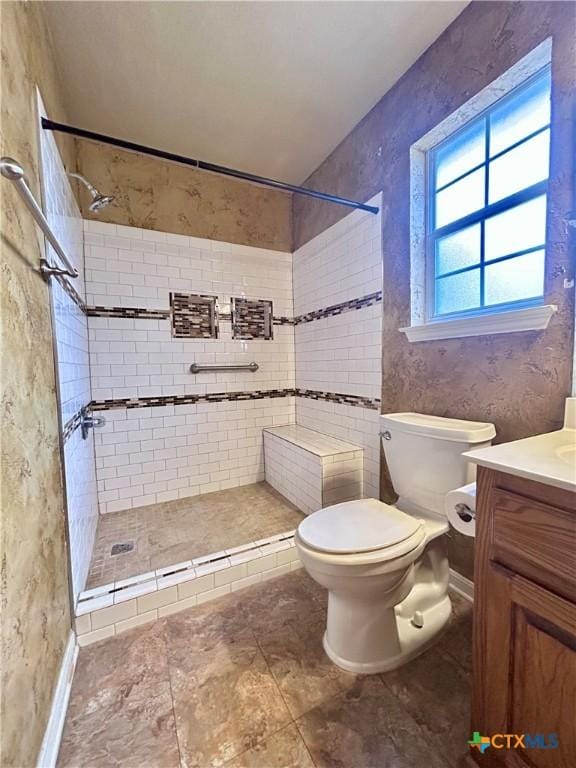 full bath with vanity, a shower stall, and toilet