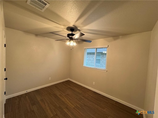 141 Atlas Ave, Killeen, TX 76542 - unfurnished room with dark wood-style floors, ceiling fan, baseboards, and a textured ceiling