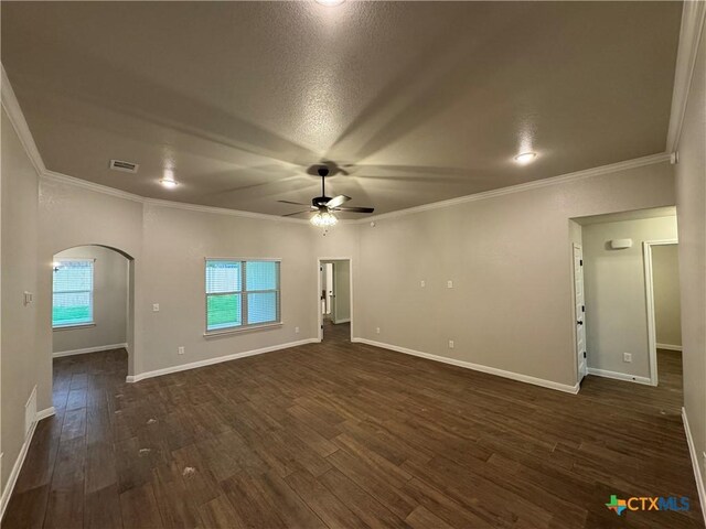 141 Atlas Ave, Killeen, TX 76542 - spare room featuring ceiling fan, ornamental molding, arched walkways, dark wood finished floors, and baseboards