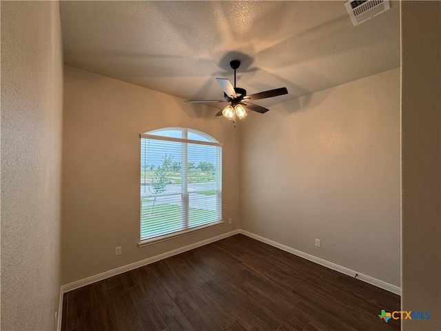141 Atlas Ave, Killeen, TX 76542 - unfurnished room featuring ceiling fan, baseboards, and dark wood-style floors